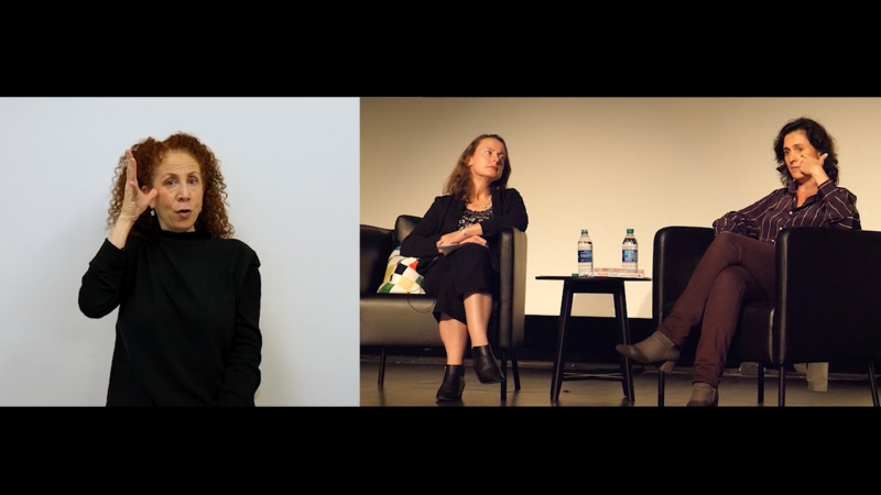 On the left side of the screen ASL interpreter seated in front of a white background. On the right side of the screen author Kamila Shamsie in discussion with Emily Wilson. 
