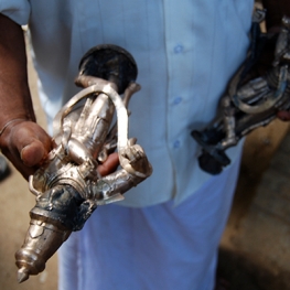 Image of a person holding a religious statue