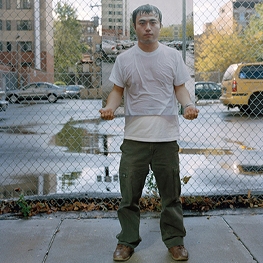 A photo of a man holding a painting