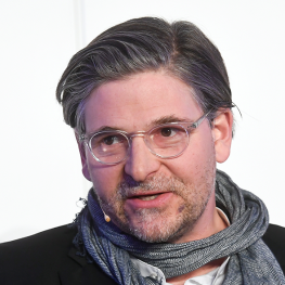 Jan Werner Mueller standing in front of a white background