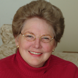 Scholar N. Katherine Hayles sitting on a couch