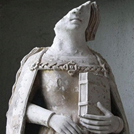 Statue of a woman from reformation era Europe with part of the face missing