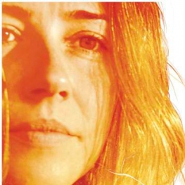 Film poster of Return (dir. Liza Johnson, 2011, 97 min.) Headshot of lead actress Linda Cardellini in orange and brown hues