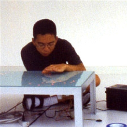 A man sitting by the table