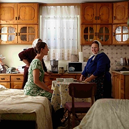 Three women in a kitchen