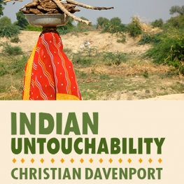 Event poster for Indian Untouchability with Christian Davenport. Woman in an orange sari carrying a bundle of sticks on her head