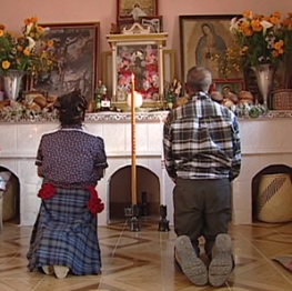 Elder religious couple praying