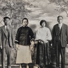 Film still from Vanishing Chinatown. Antique photo collage of Chinese family in a photography studio. 